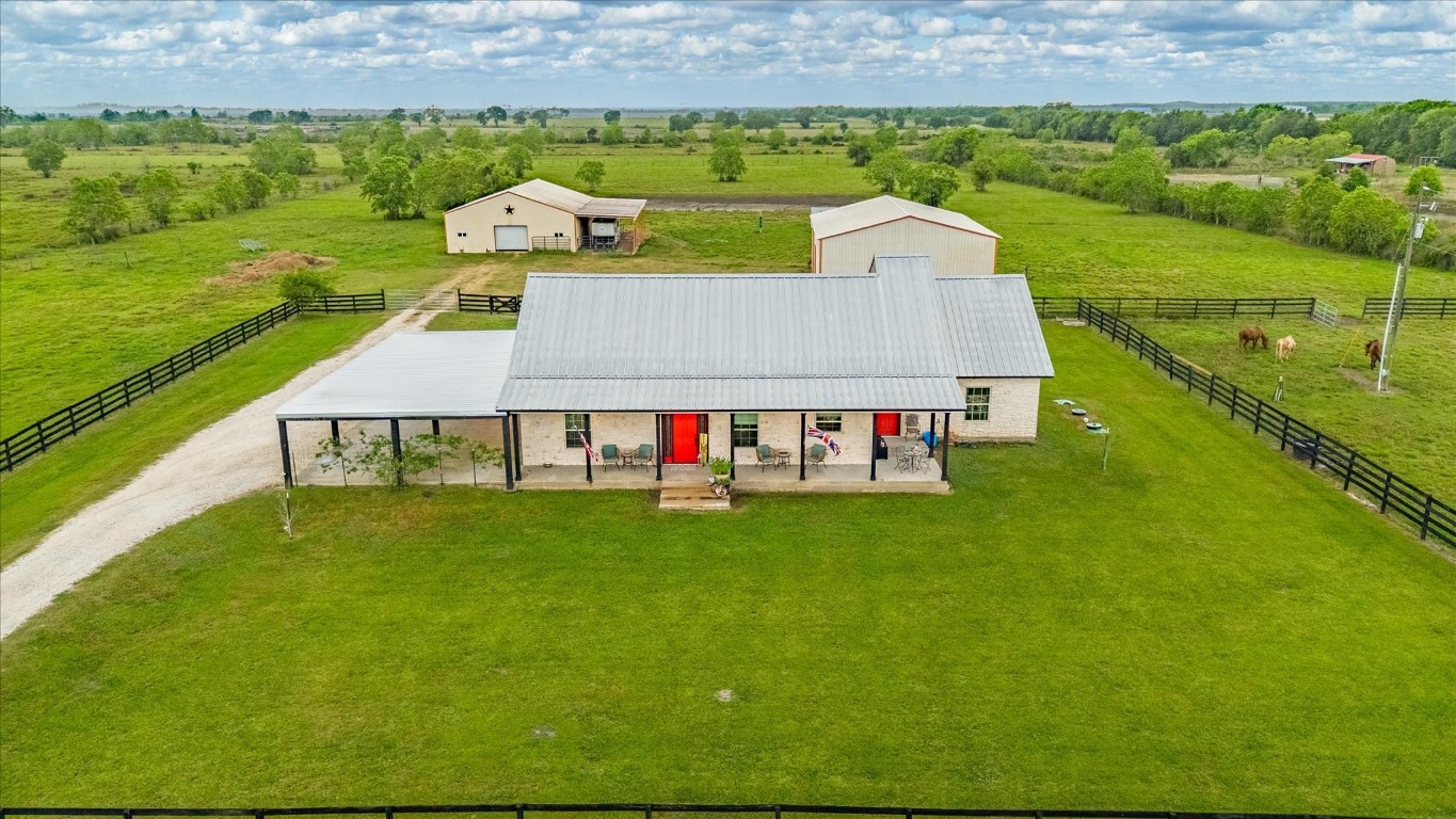 1755 McBride-Devillier Loop Winnie, TX 77665 - Photo 43 of 44 an aerial view of a house with a garden