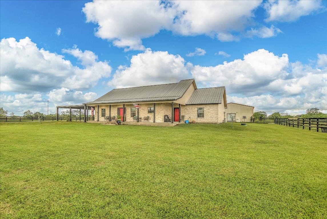 1755 McBride-Devillier Loop Winnie, TX 77665 - Photo 6 of 44 a view of a house with a big yard