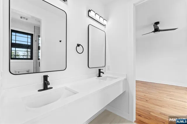 a bathroom with a sink and mirror