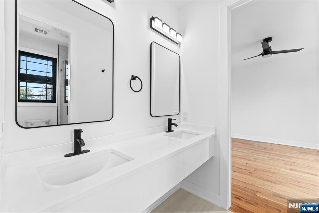 465 Cherry Lane Mendham, NJ 07945 - Photo 20 of 38 a bathroom with a sink and mirror