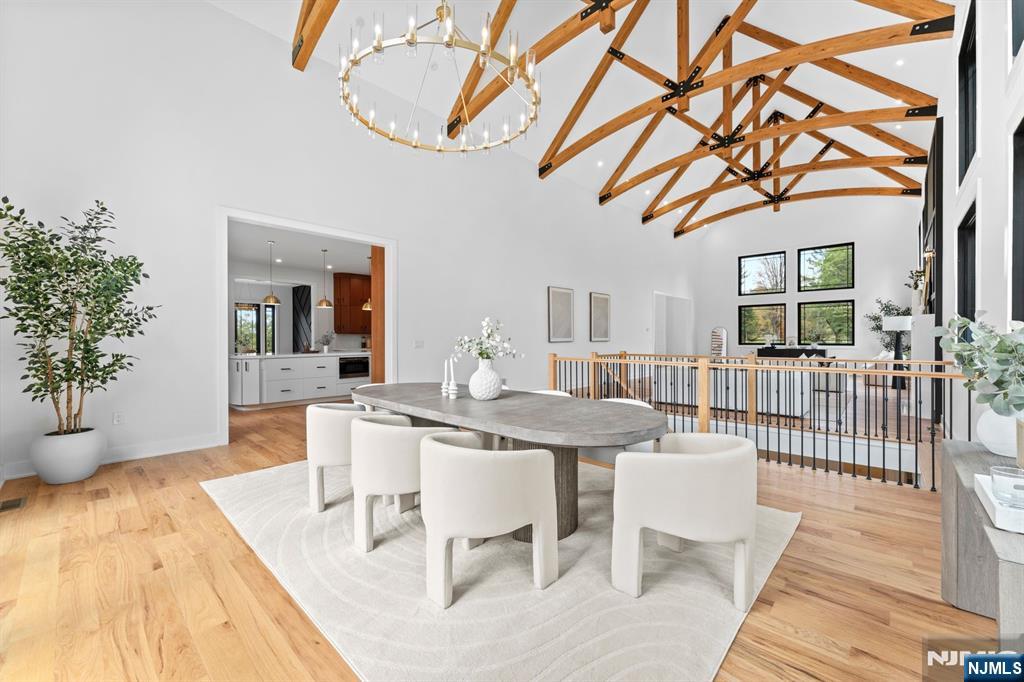 465 Cherry Lane Mendham, NJ 07945 - Photo 26 of 38 a dining room with furniture a chandelier and wooden floor