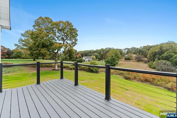 a view of outdoor space with deck and yard