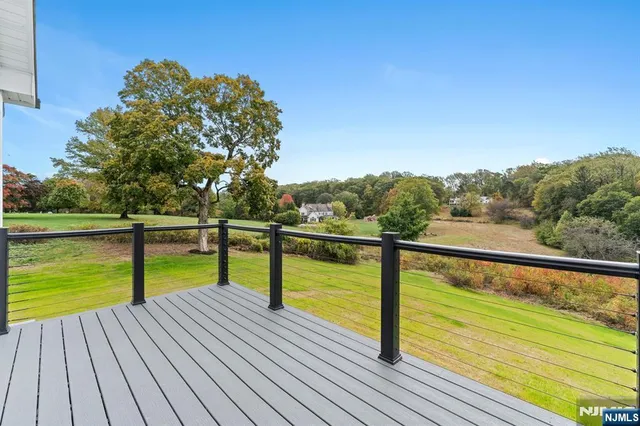 a view of outdoor space with deck and yard