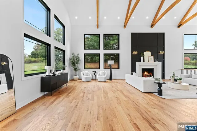 a bedroom with a large bed and a large window