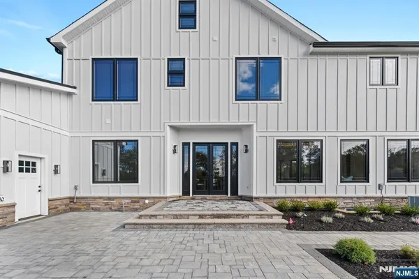 a view of a building with car parked