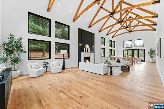 a living room with furniture fireplace and window