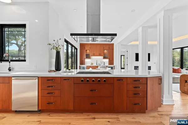 a spacious bathroom with a granite countertop sink mirror and
