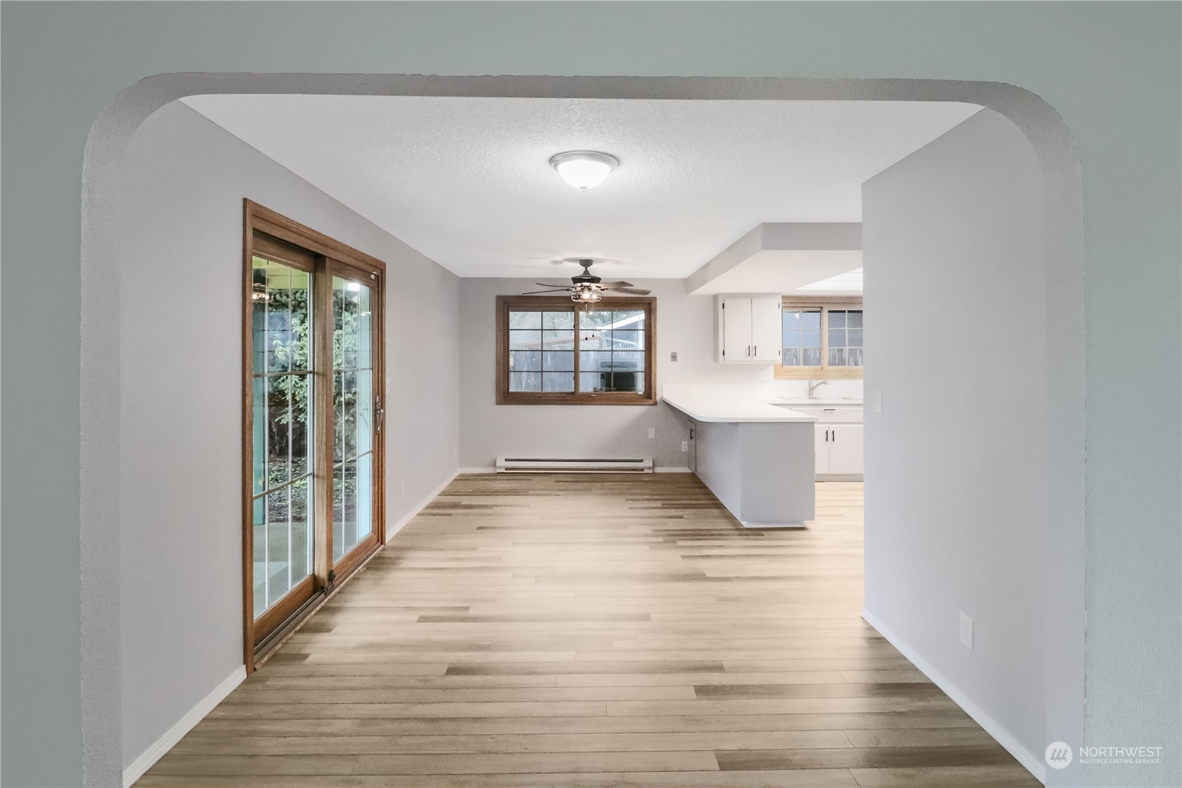 18237 Nutmeg Court Southwest Rochester, WA 98579 - Photo 16 of 34 a big room with wooden floor and windows