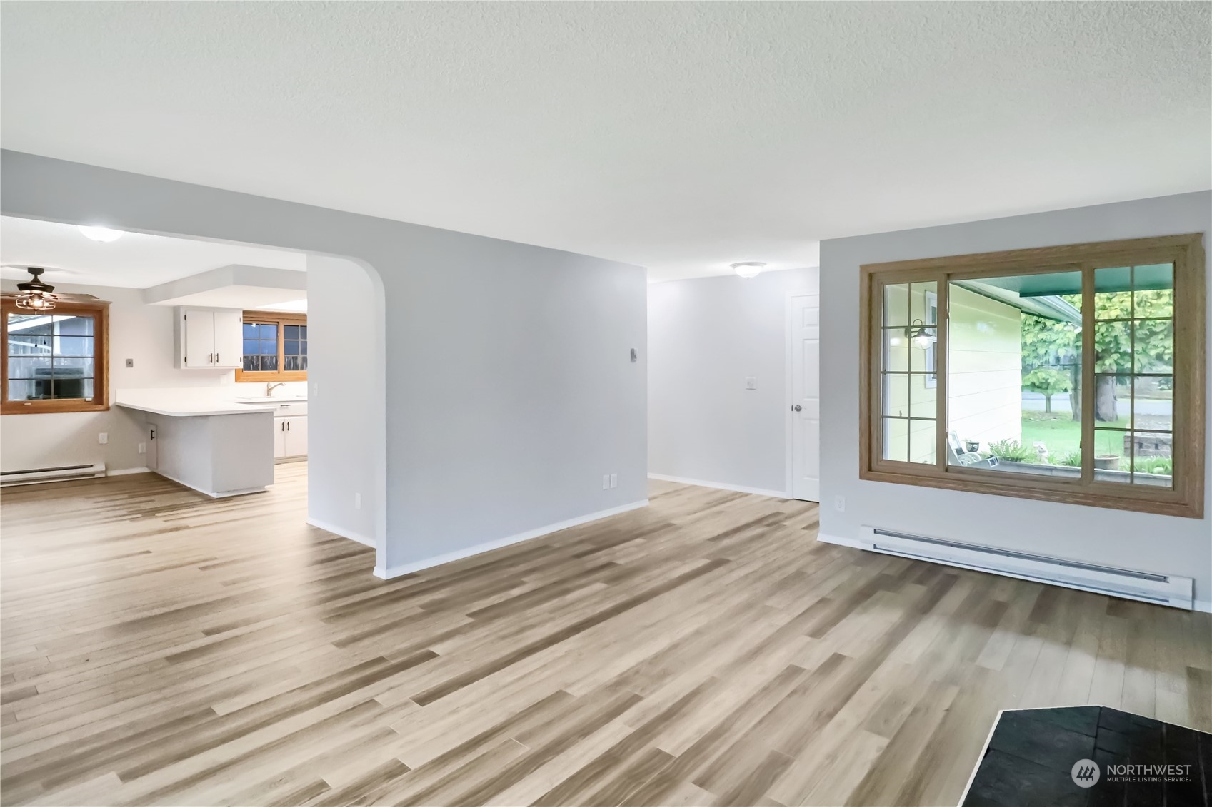 18237 Nutmeg Court Southwest Rochester, WA 98579 - Photo 18 of 34 a view of empty room with wooden floor and fan