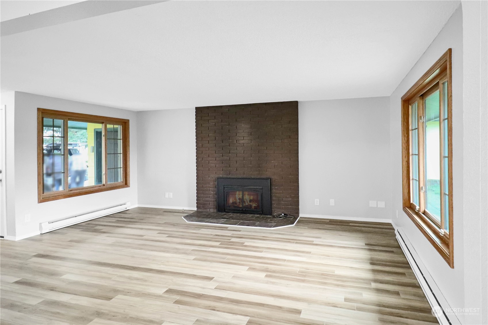 18237 Nutmeg Court Southwest Rochester, WA 98579 - Photo 20 of 34 a view of an empty room with glass door and wooden floor