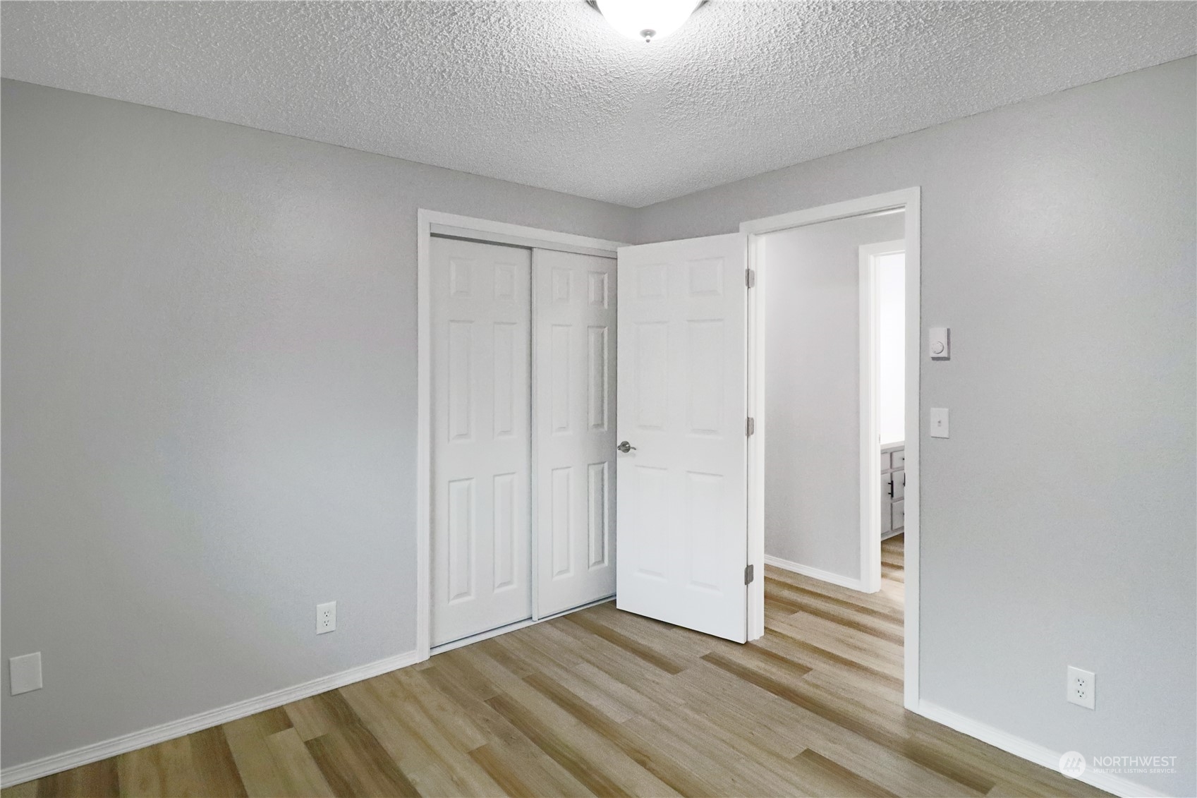 18237 Nutmeg Court Southwest Rochester, WA 98579 - Photo 22 of 34 a view of an empty room and wooden floor