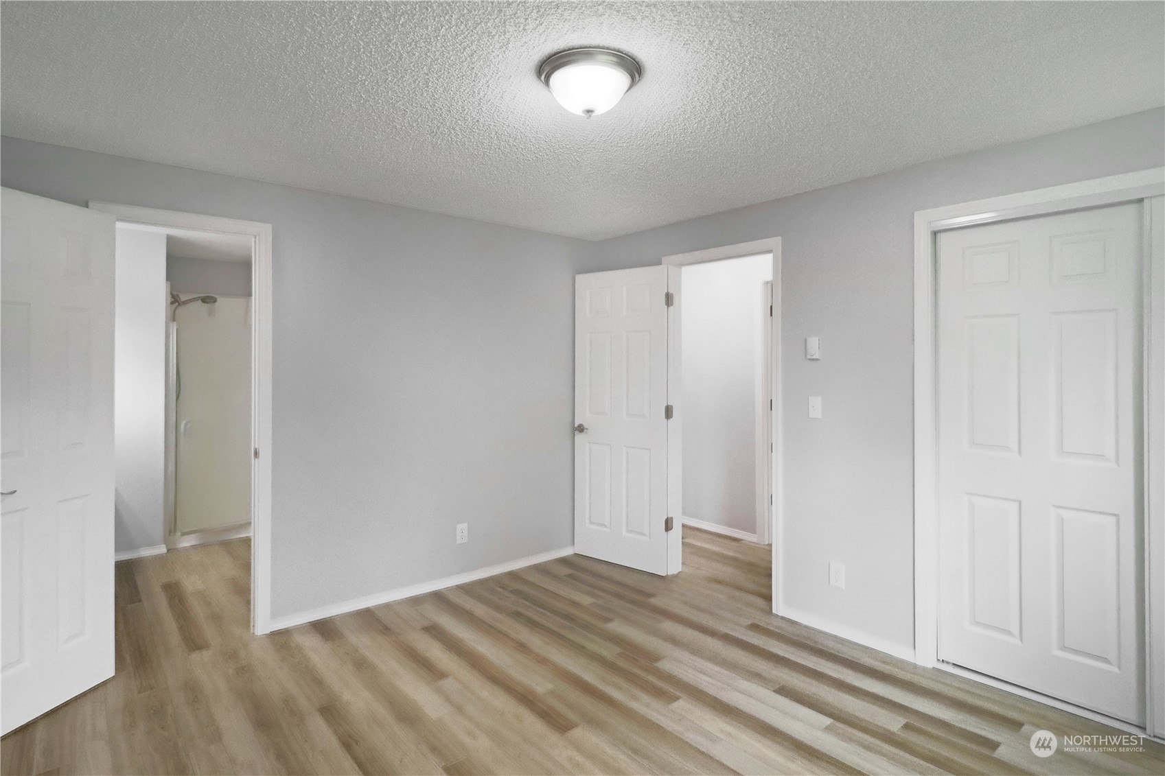 18237 Nutmeg Court Southwest Rochester, WA 98579 - Photo 25 of 34 a view of empty room with wooden floor