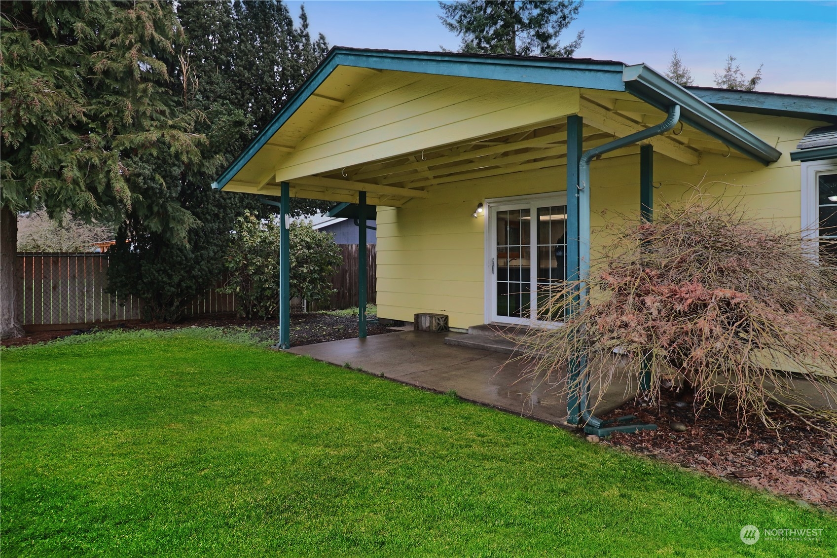 18237 Nutmeg Court Southwest Rochester, WA 98579 - Photo 4 of 34 a view of a backyard with plants and large trees