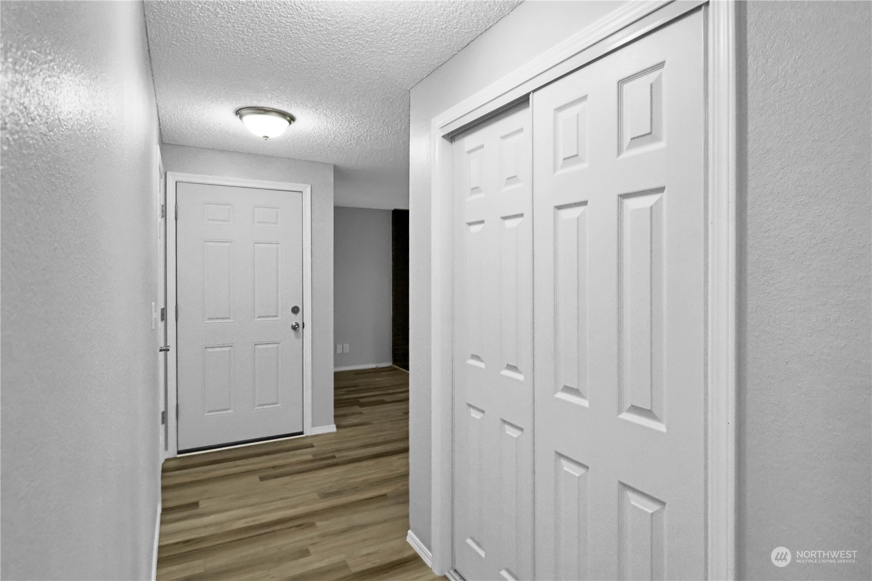 18237 Nutmeg Court Southwest Rochester, WA 98579 - Photo 7 of 34 a view of a hallway with wooden floor