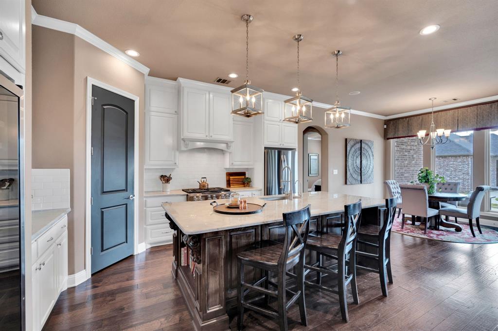 136 Sullivan Way Waxahachie, TX 75167 - Photo 11 of 40 a view of a dining room with furniture window and wooden floor