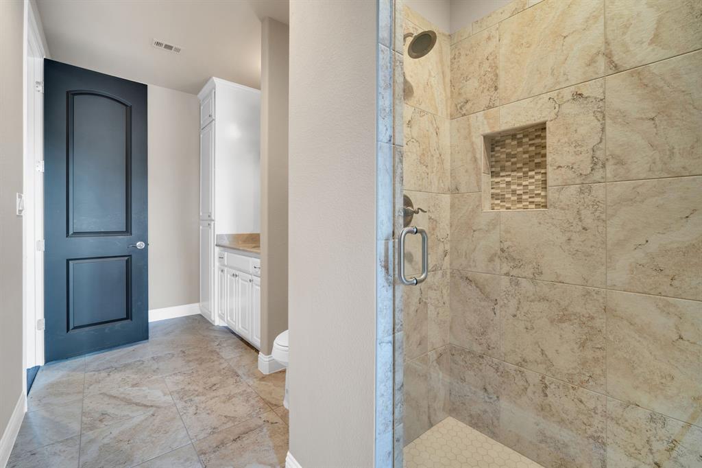 136 Sullivan Way Waxahachie, TX 75167 - Photo 20 of 40 a bathroom with a shower and a sink
