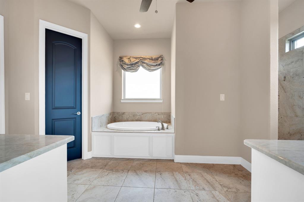 136 Sullivan Way Waxahachie, TX 75167 - Photo 23 of 40 a bathroom with a granite countertop sink a toilet and mirror
