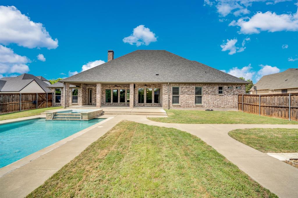 136 Sullivan Way Waxahachie, TX 75167 - Photo 29 of 40 a house with swimming pool in front of it