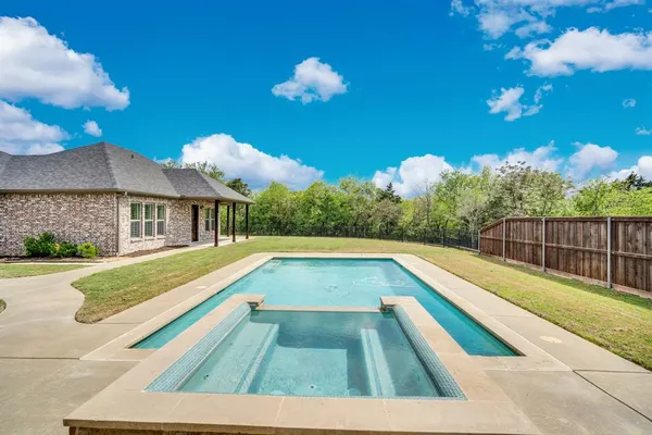 a view of swimming pool with lounge chair