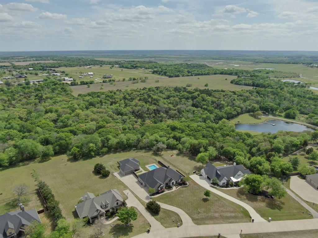 136 Sullivan Way Waxahachie, TX 75167 - Photo 38 of 40 an aerial view of a houses with a yard