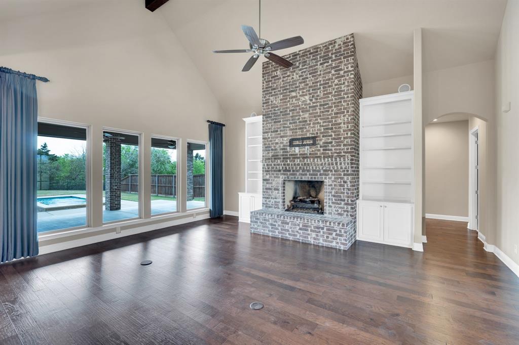 136 Sullivan Way Waxahachie, TX 75167 - Photo 8 of 40 a view of empty room with wooden floor and fireplace