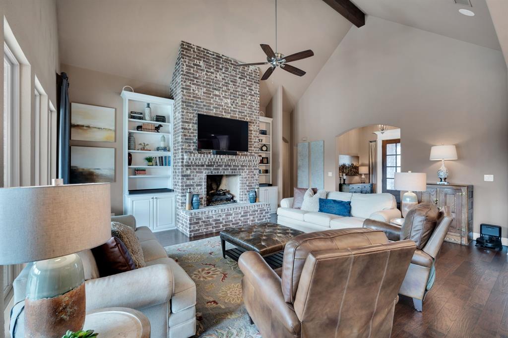 136 Sullivan Way Waxahachie, TX 75167 - Photo 9 of 40 a living room with furniture a fireplace and a flat screen tv
