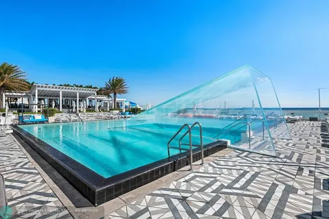 a view of swimming pool with a patio