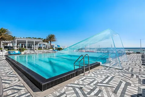 a view of swimming pool with a patio