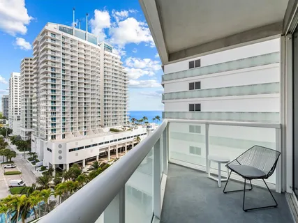 a balcony with a potted plant