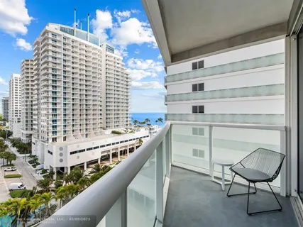 a balcony with a potted plant