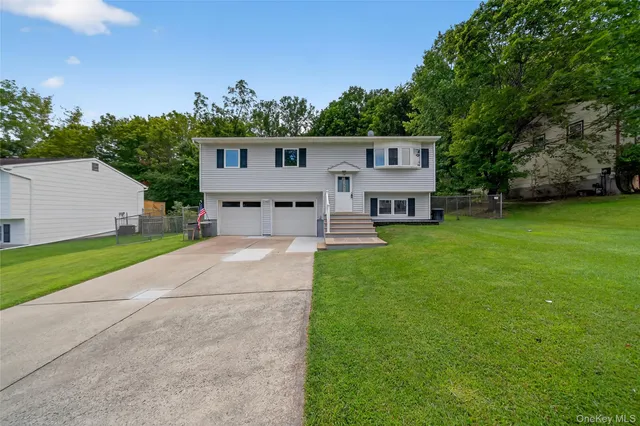 a view of a house with a back yard