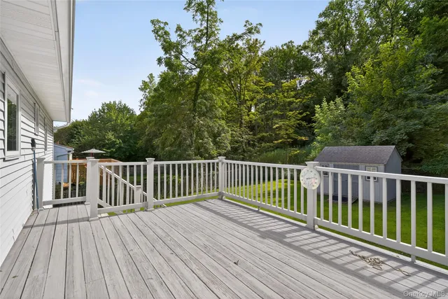 a view of deck with wooden floor and fence