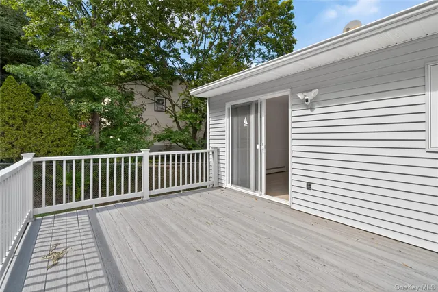 a view of backyard with a deck
