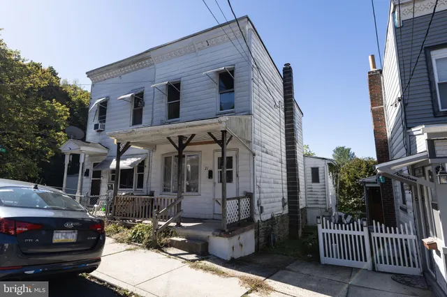 a front view of a house with parking