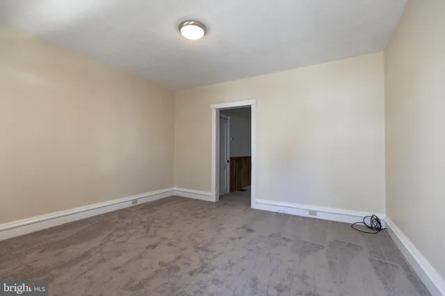 an empty room with an empty space and a window