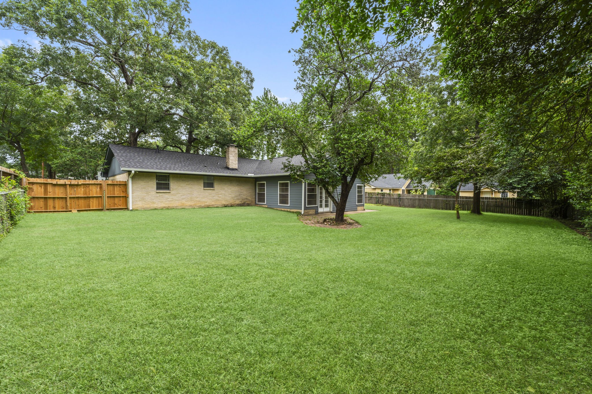 209 Summit Drive Conroe, TX 77303 - Photo 21 of 23 Whether hosting friends, playing with pets, or simply relaxing outdoors, this backyard provides the flexibility buyers are craving.