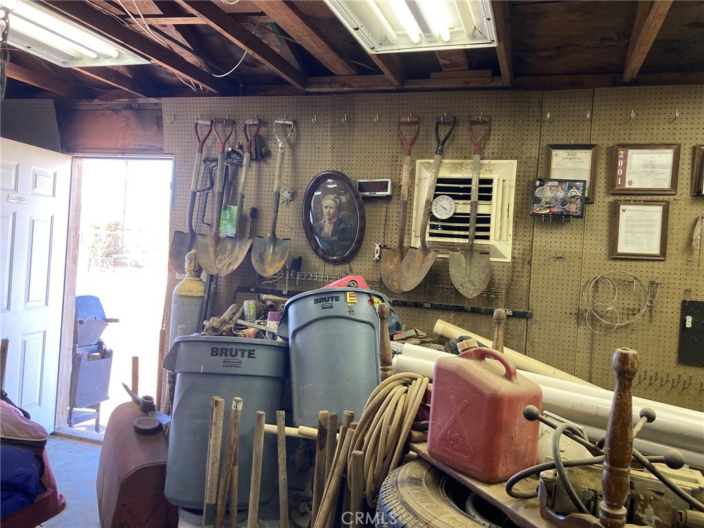 35127 Condor Road Newberry Springs, CA 92365 - Photo 23 of 60 a room with chairs a washer and dryer