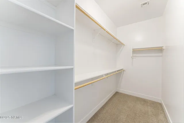 a view of an empty walk in closet