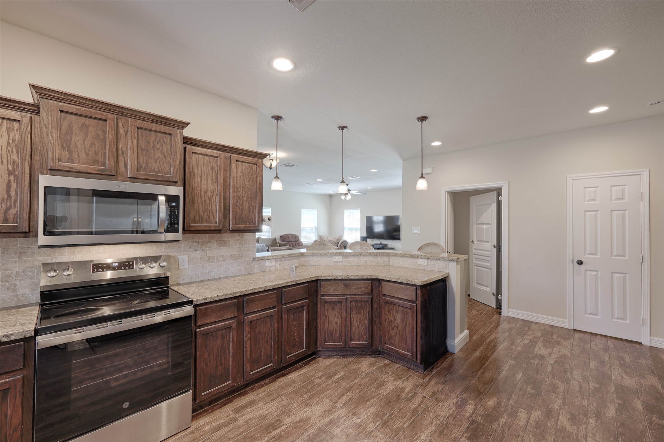 1122 Detroit Street College Station, TX 77840 - Photo 11 of 48 Kitchen overlooks the living room and has direct access to laundry room and half bath for guests.