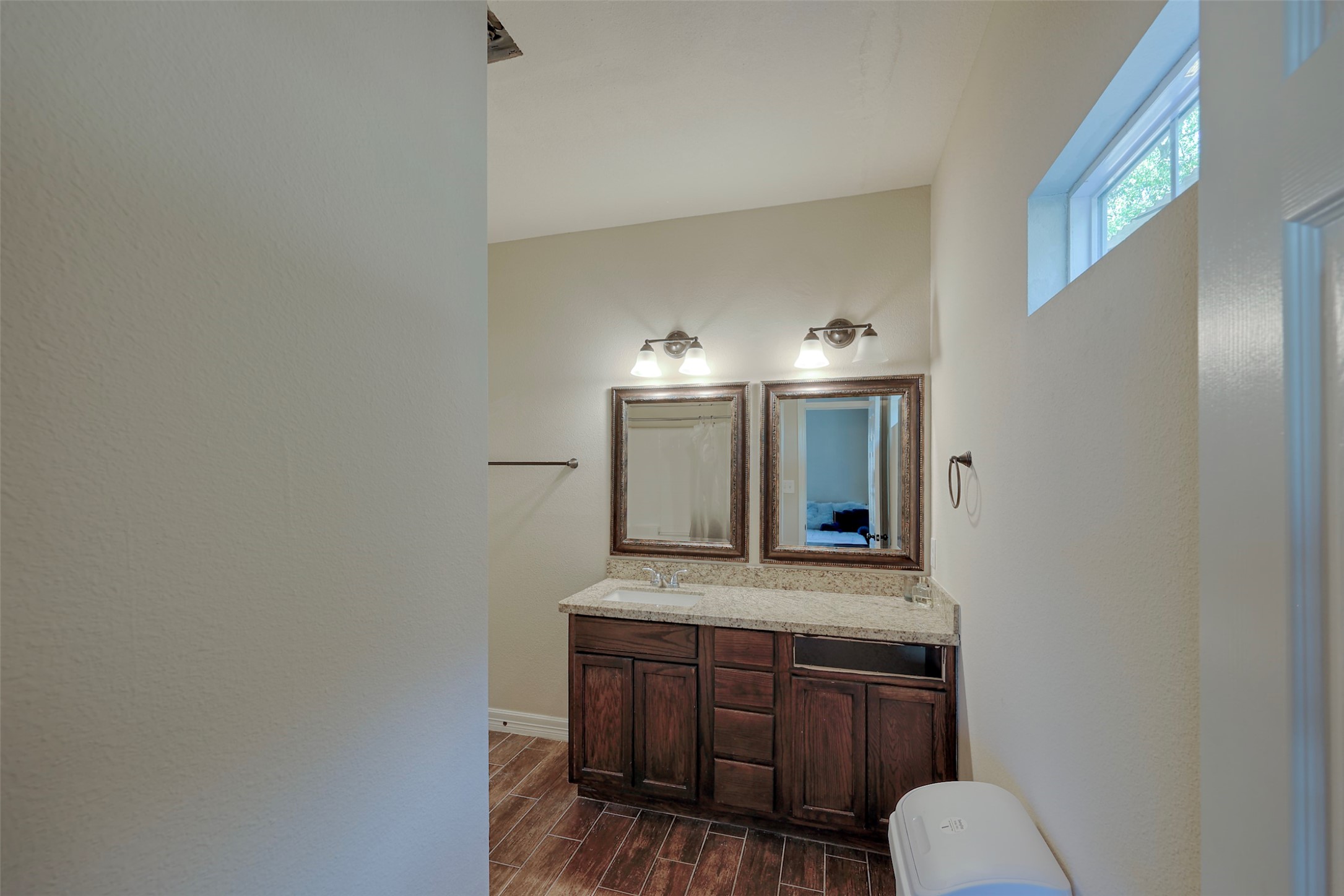 1122 Detroit Street College Station, TX 77840 - Photo 14 of 48 En-suite bathroom for bedroom #1 downstairs. Tile floors, granite counters and tub/shower combo.