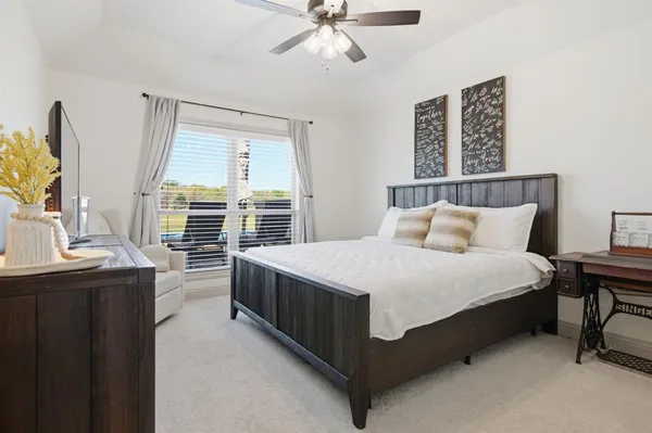 a bed room with a bed and a chandelier