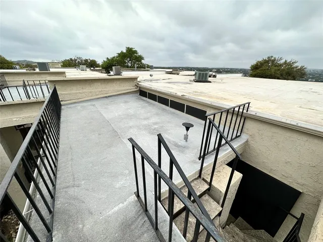 a view of roof deck with seating space and barbeque oven