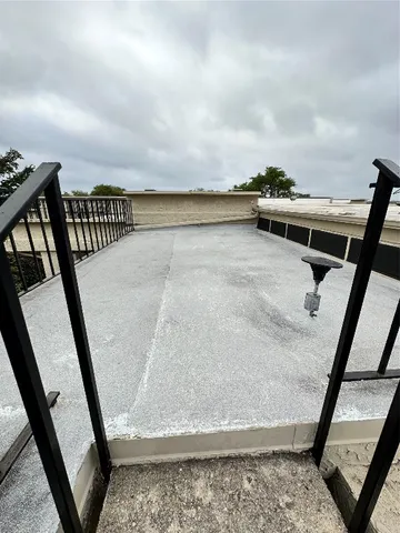 a view of balcony with furniture
