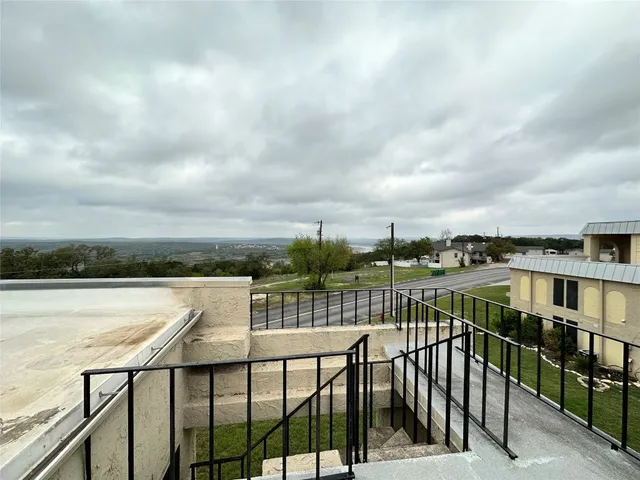 a view of a balcony with an ocean