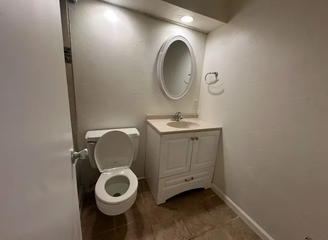 a bathroom with a toilet and a sink
