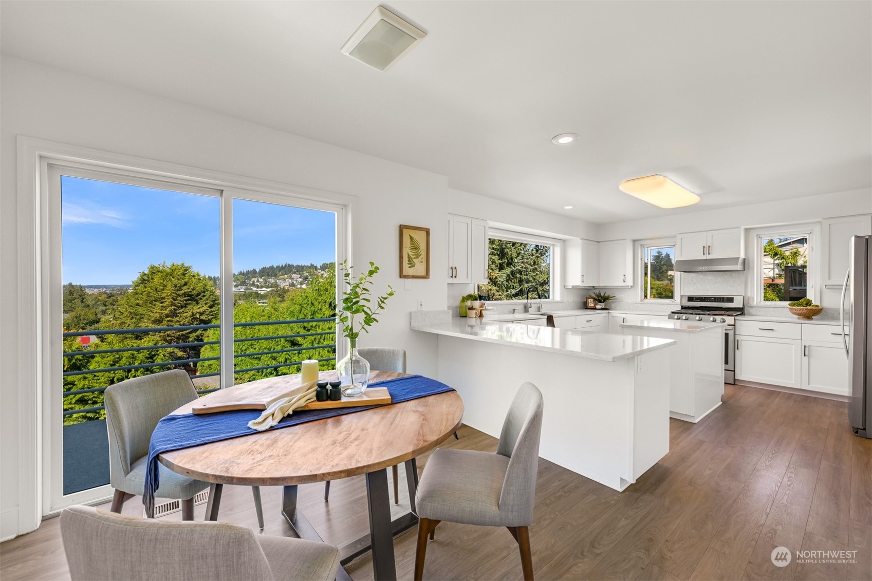 215 Bayside Road Bellingham, WA 98225 - Photo 11 of 38 a kitchen with a table and chairs in it