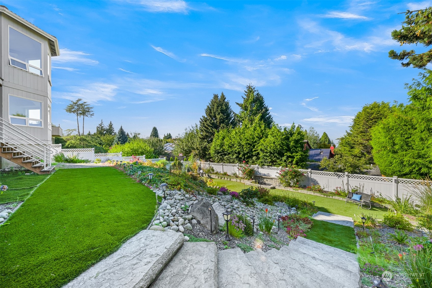 215 Bayside Road Bellingham, WA 98225 - Photo 33 of 38 a view of a garden with a building in the background