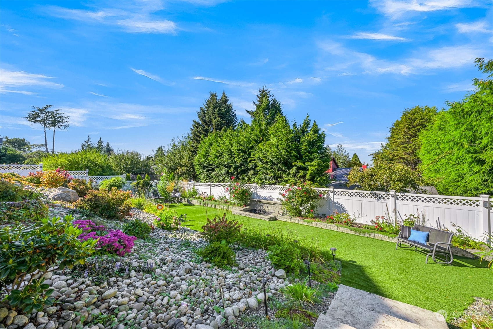 215 Bayside Road Bellingham, WA 98225 - Photo 34 of 38 a view of a garden with a building in the background