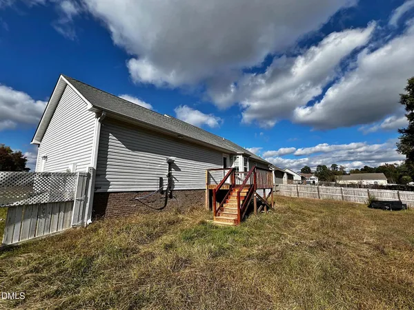 a house view with a backyard space