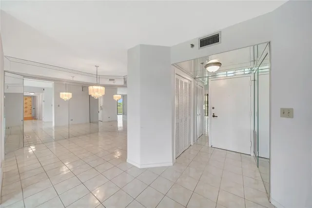 a bathroom with a sink mirror and a bathtub